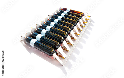 Group of ampoules with a transparent medicine in medical laboratory. lot of ampoules on light background.