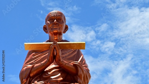 Reverend Father To, Wat Bosot, on August 4, 2022, at Wat Bosoth, Sam Khok, Pathum Thani Province. In blue sky day. photo