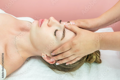 Beautiful girl doing facial massage © Tania
