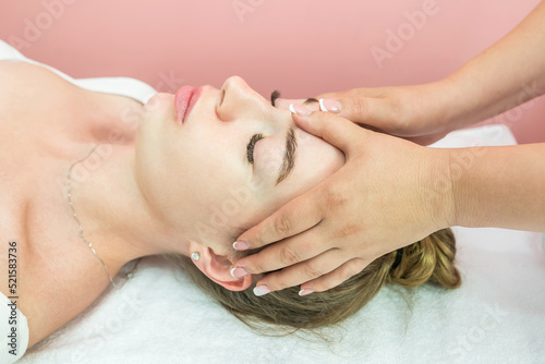 Beautiful girl doing facial massage