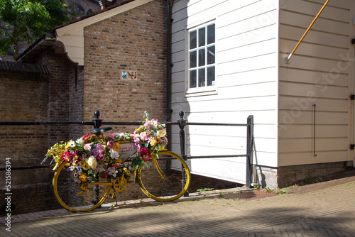 Flower bicycle parked on the street in the Netherlands