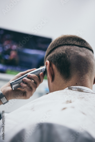 Barbershop haircut styling with hair clipper