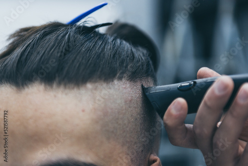 Barbershop haircut styling with hair clipper