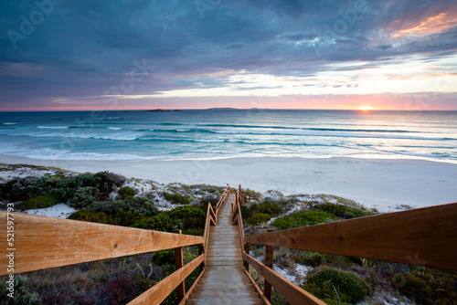 Beautiful image of sunset, stairs, sky, and beach in Esperance, Western Australia photo