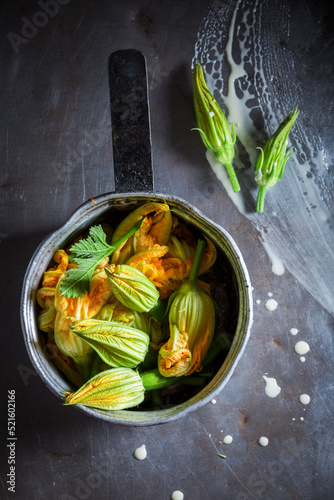 Ingredients for roasted zucchini flower as seasonal snack.