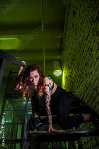 Sexy girl dance on front of spot light wall with smoke