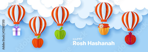 Rosh Hashanah jewish holiday banner design with paper cut hot air balloon, apple, honey and pomegranate. Vector illustration.