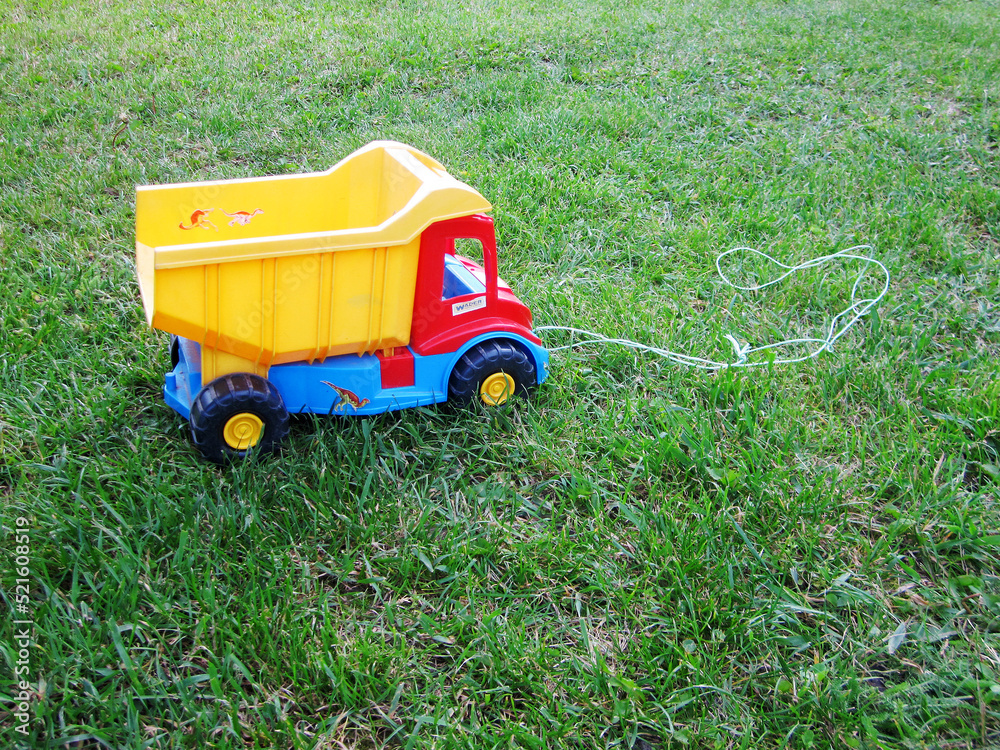 Fototapeta premium Photo on theme of plastic large children's toy truck