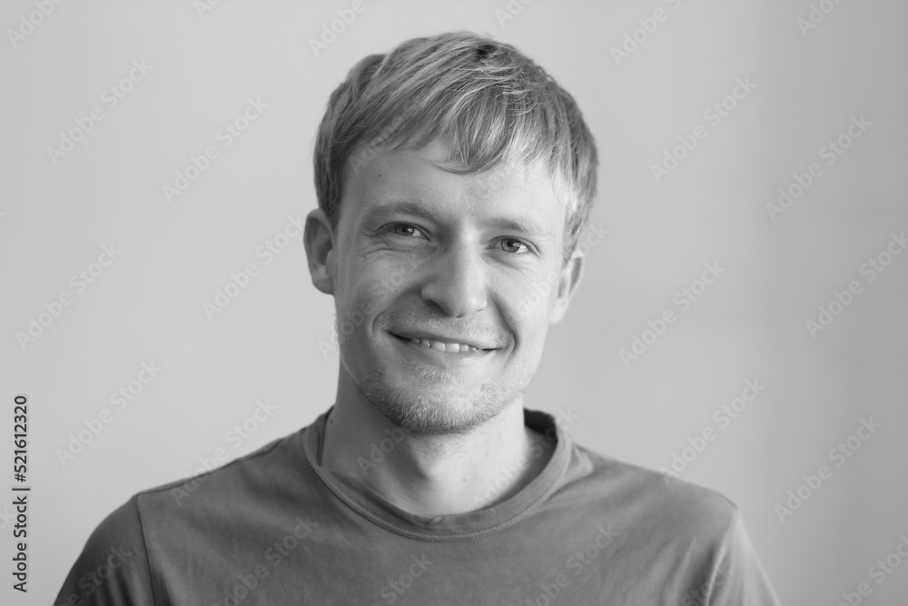 Handsome blond guy smiles.
Black and white portrait of a smiling and happy man. Handsome blond guy smiles.
Black and white portrait of a smiling and happy man.