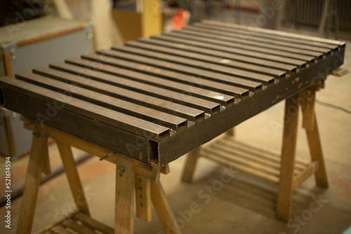 Steel table. Industrial processing. Details of work with structure.