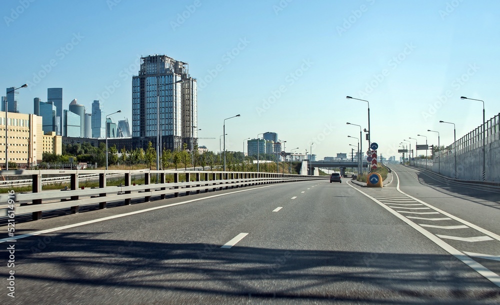 Fototapeta premium The road separates, one of the roads leads to the bridge
