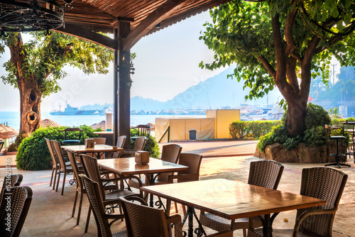 Ship and cafe tables on the beach, Marmaris, Turkey