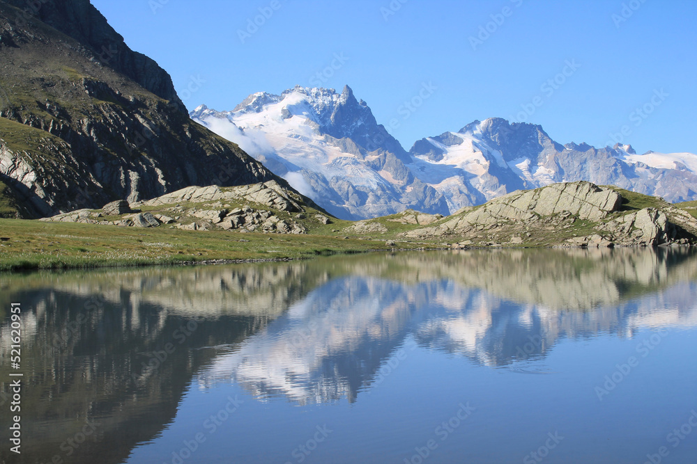 Goleon lake in the french Alps with view on La Meije mountain 
