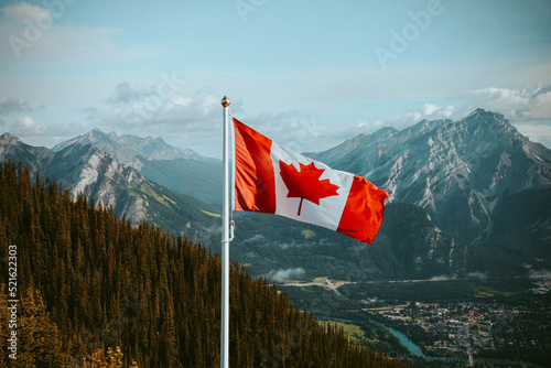 Canvas Print Canadian Flag overlooking mountains in Banff
