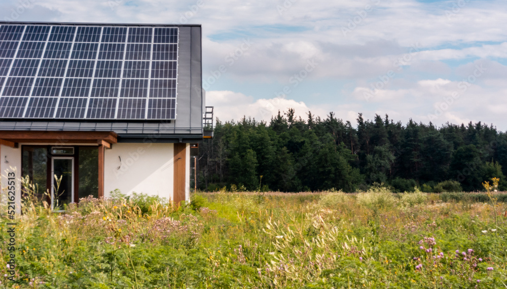 Rural house with solar panels on the roof