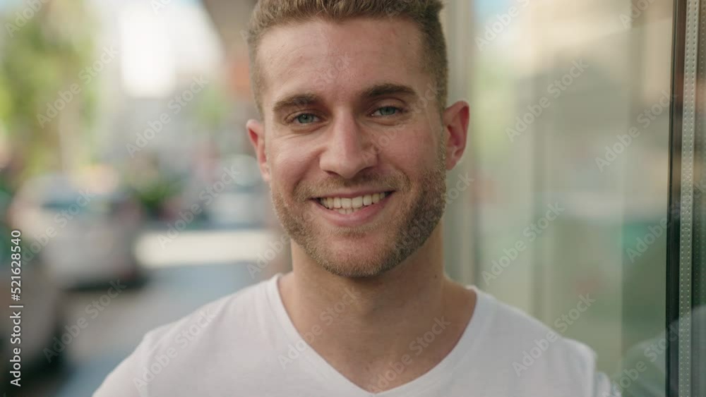 Young caucasian man smiling confident standing at street Young caucasian man smiling confident standing at street