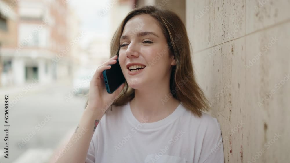 Young woman smiling confident talking on the smartphone at street Young woman smiling confident talking on the smartphone at street