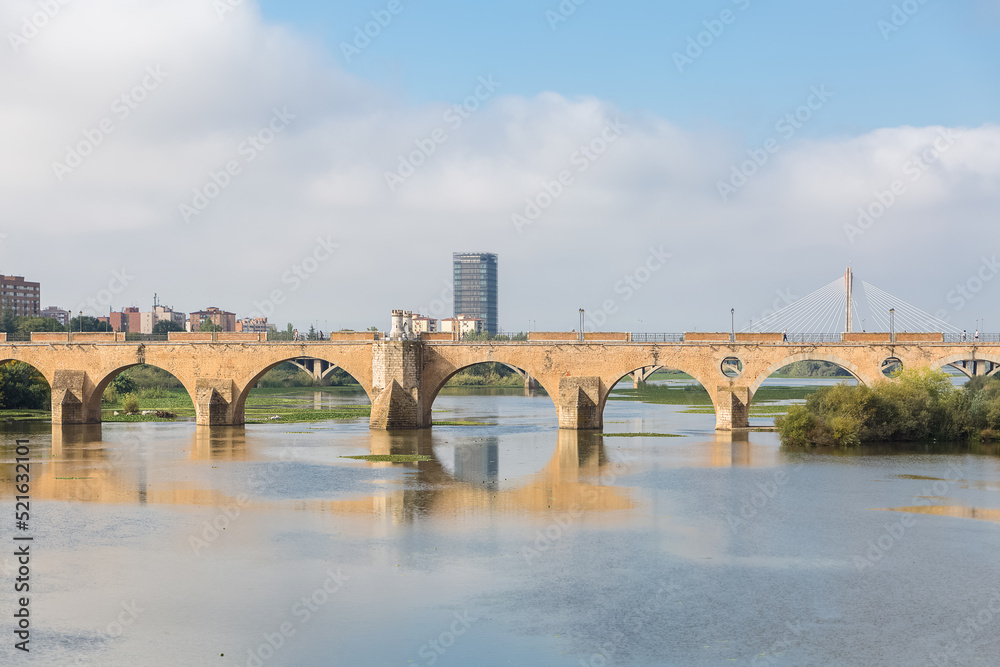 Amazing morning view at the Guadiana river and Palmas bridge, Guadiana Park river on banks, Badajoz downtown city, Spain