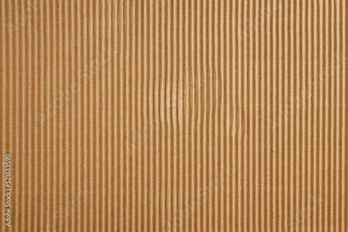 Craft Striped Corrugated Paper Texture Background. Recycling Material. Closeup shot