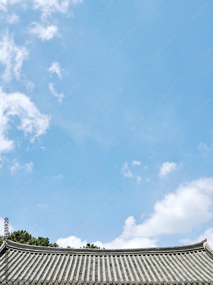 Traditional Korean tiled roof and blue sky