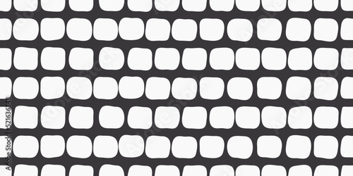 
White uneven pads on a black background. Decorative pattern seamless and stylish of white rounded shapes.