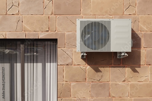 outdoor air conditioner unit on the wall of the house near the window 3d  photo