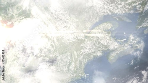 Earth zoom in from outer space to city. Zooming on Shawinigan, Quebec, Canada. The animation continues by zoom out through clouds and atmosphere into space. Images from NASA photo