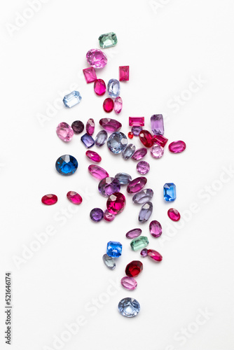 Synthetic Stones for jewellery making. Faceted colorful glass rhinestones on White photo