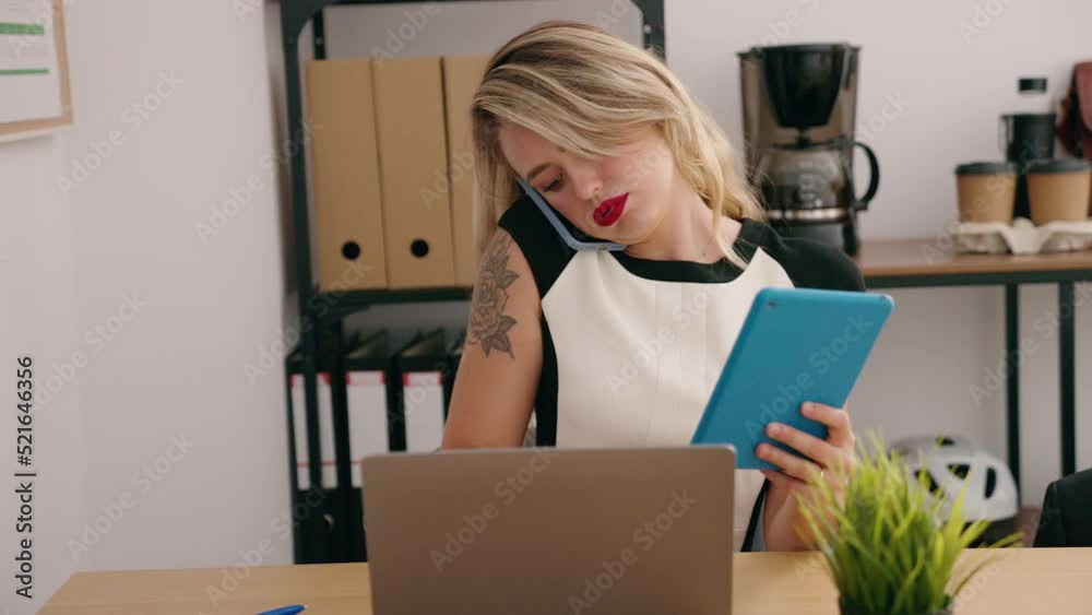 Young beautiful hispanic woman business worker talking on smartphone using touchpad at office Young beautiful hispanic woman business worker talking on smartphone using touchpad at office