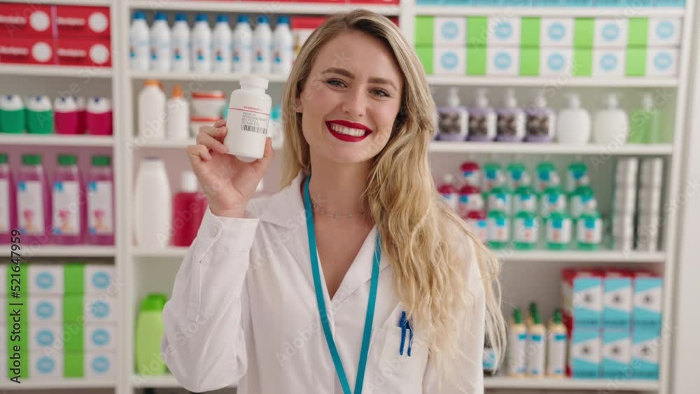 Young beautiful hispanic woman pharmacist smiling confident holding pills bottle at pharmacy Young beautiful hispanic woman pharmacist smiling confident holding pills bottle at pharmacy