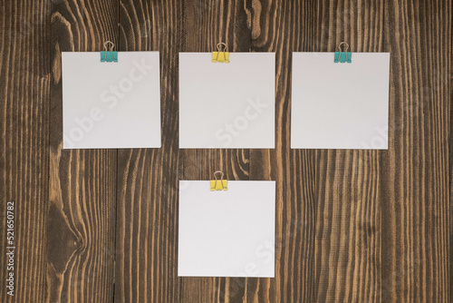 small square sheets for notes on a wooden background , September 1 concept