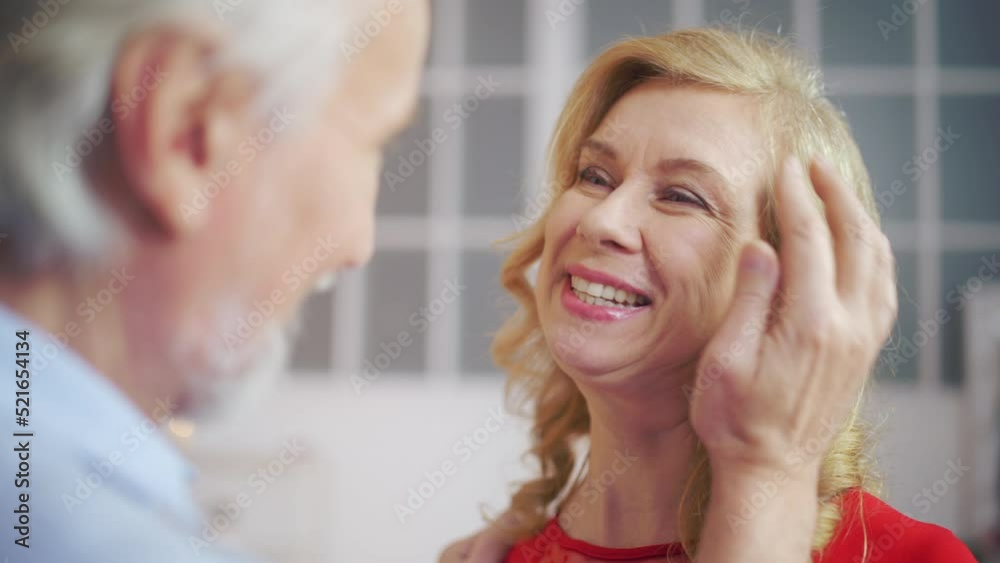 Middle-aged man flirting with his beloved woman, couple in love, emotions Middle-aged man flirting with his beloved woman, couple in love, emotions