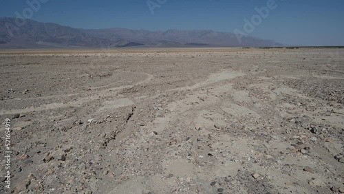 The hot dry flat land at the basin of Death Valley National park in California. photo