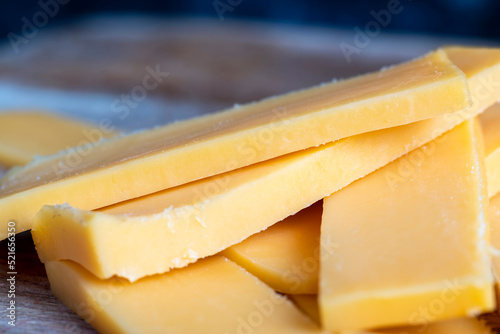 Sliced yellow cheese made from cow's milk