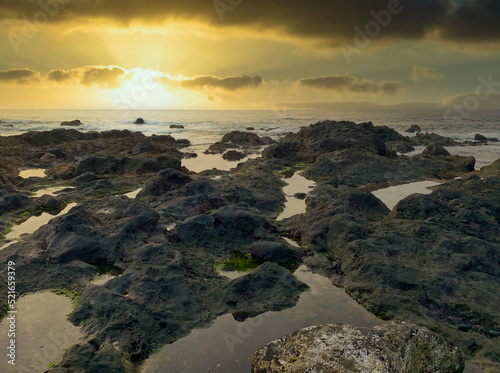 The rocks alternate with the sand on the beach of Punta Brava (Puerto de la Cruz, Tenerife)