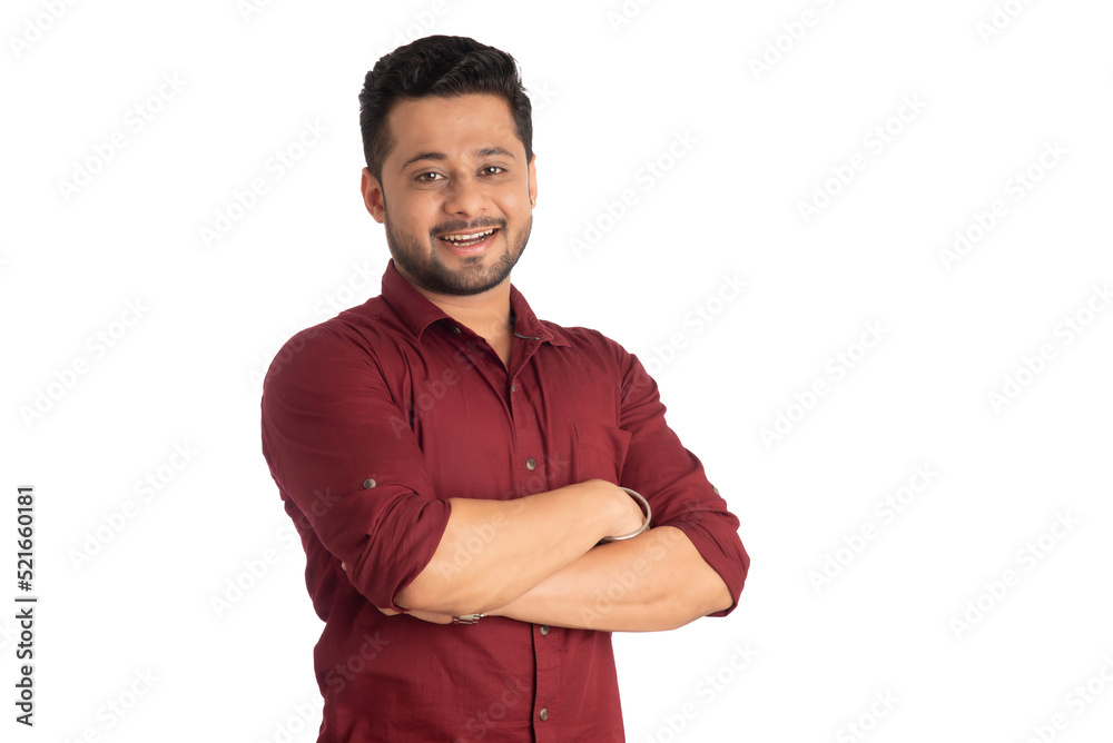 Portrait of a happy young man posing with arms crossed or hands folded on a white background Portrait of a happy young man posing with arms crossed or hands folded on a white background