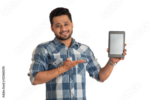 Young handsome man  businessman showing a blank screen of a smartphone or mobile or tablet phone on white background