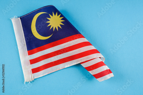 Malaysia Flag on blue background 