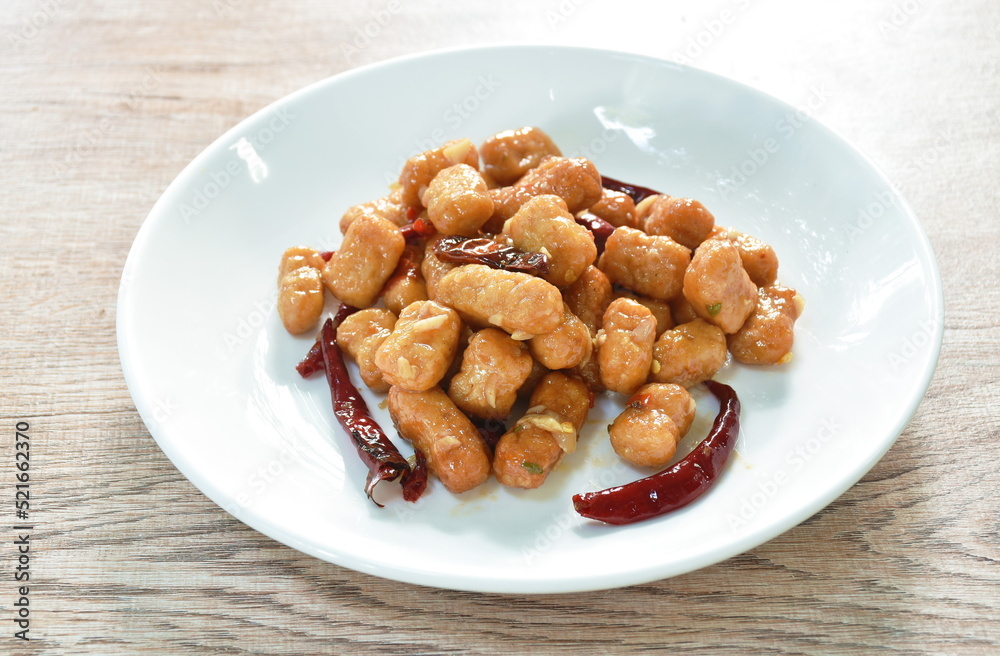 fried chicken meat with dry chili on plate fried chicken meat with dry chili on plate