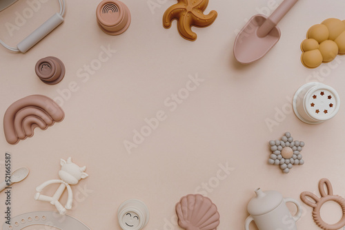 Set of different toys on pastel pink background with blank empty copy space. Flat lay, top view