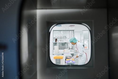 Women work in the lab. Conducts experiments on vaccines. © Anischenko