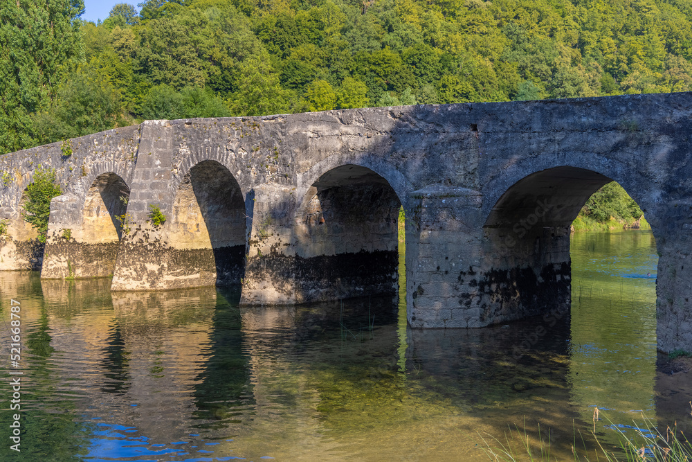 The old stone bridge on the Dobra River, Croatia