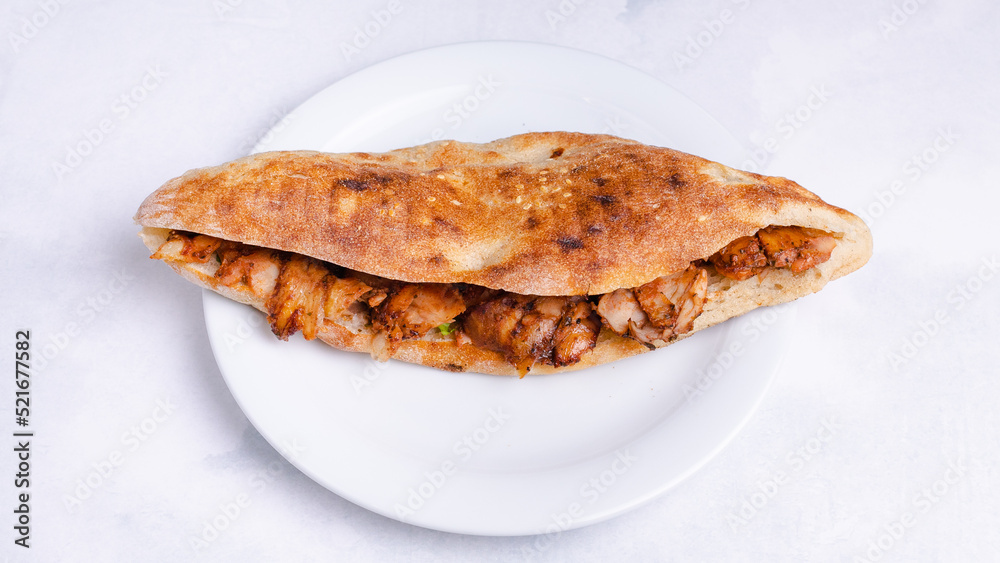 Chicken doner kebab in plate top view isolated