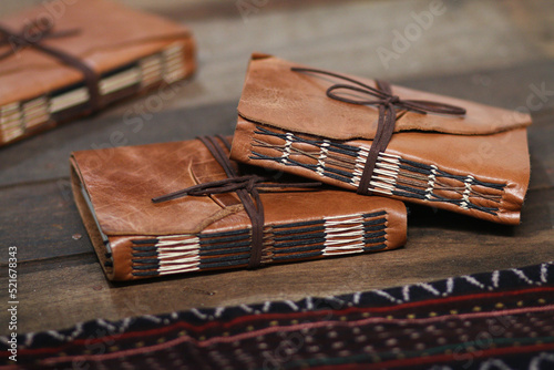 Vintage Dark Brown Leather Notebook Journal on Wooden Table