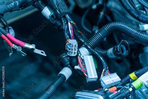 Large wide cable with wires and connectors and terminals in the wiring repair shop and electricians for connecting photo