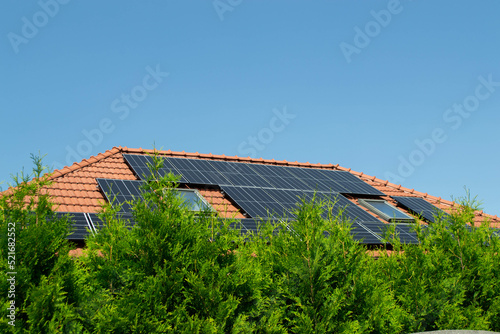 Wallpaper Mural House roof with photovoltaic modules. Historic farm house with modern solar panels on roof and wall High quality photo Torontodigital.ca