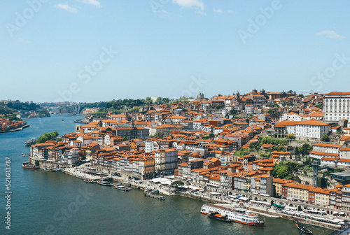 View of Duoro bay of Oporto city from top with boats navigating  © Radu