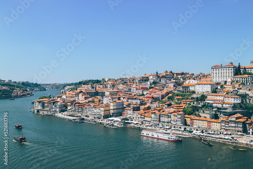View of Duoro bay of Oporto city from top with boats navigating 