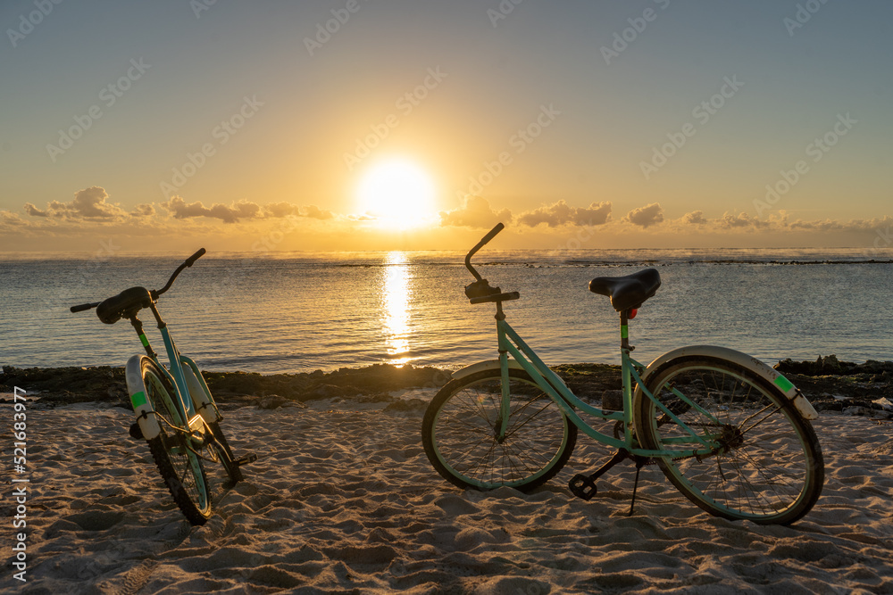 Fototapeta premium Bicycles resting at dawn by the beach