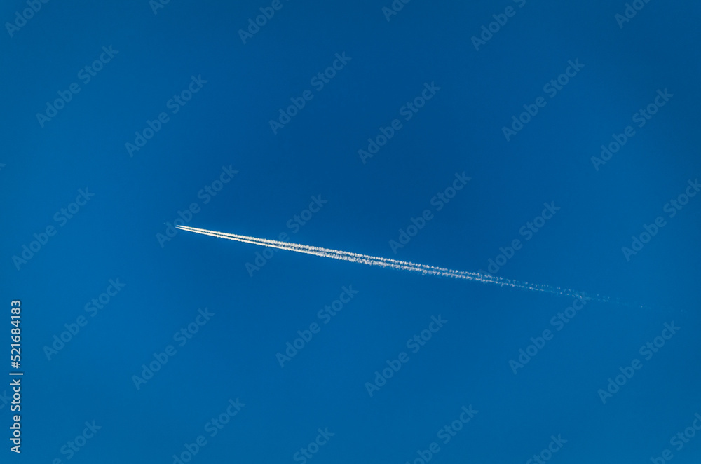 View of an airplane on blue sky background View of an airplane on blue sky background